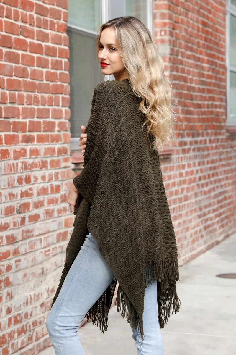 Knit Tasseled Ruanas.