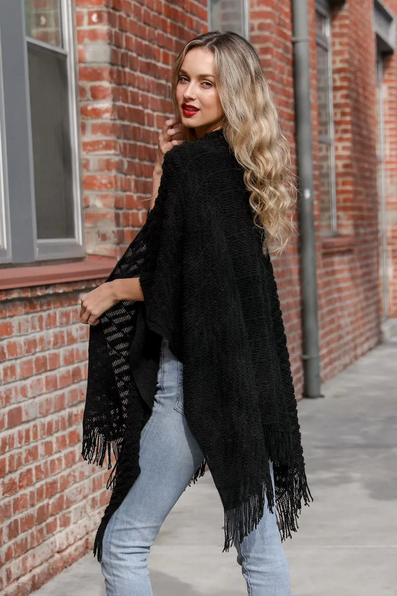 Knit Tasseled Ruanas.