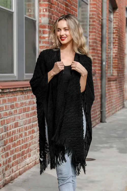Knit Tasseled Ruanas.