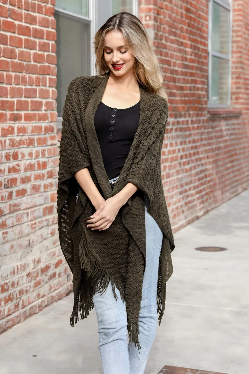 Knit Tasseled Ruanas.
